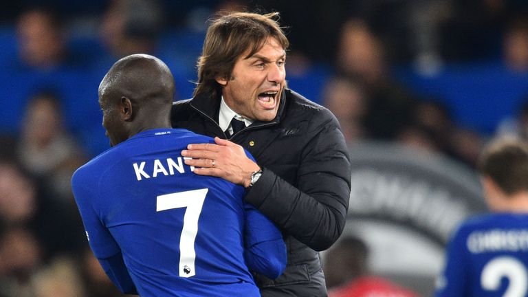 Chelsea's Italian head coach Antonio Conte celebrates on the pitch with Chelsea's French midfielder N'Golo Kante (L) after the win over Manchester United