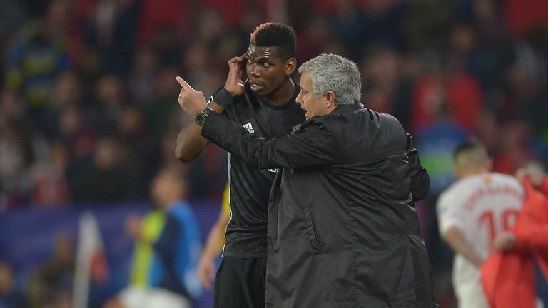Paul Pogba takes instructions from Jose Mourinho during Manchester United's clash with Sevilla