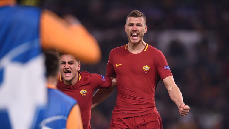 Edin Dzeko celebrates after scoring for Roma