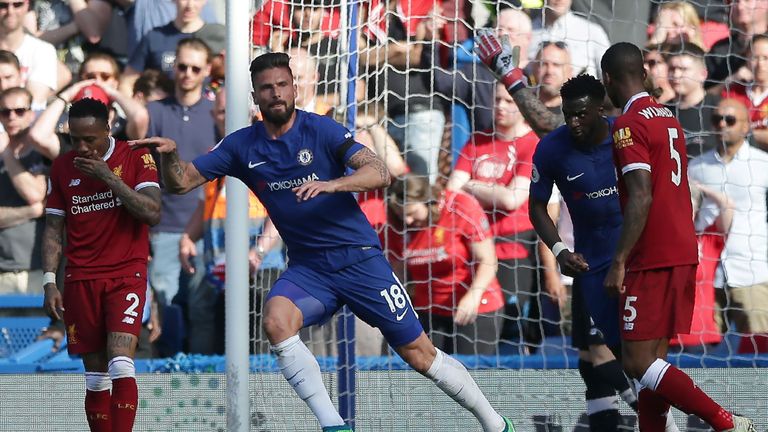 Olivier Giroud celebrates after finding the net with a 32nd minute header
