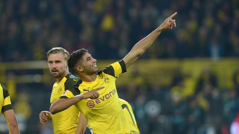 DORTMUND, GERMANY - SEPTEMBER 26: Achraf Hakimi of Borussia Dortmund celebrates after scoring his team`s third goal during the Bundesliga match between Borussia Dortmund and 1. FC Nuernberg at Signal Iduna Park on September 26, 2018 in Dortmund, Germany. (Photo by TF-Images/Getty Images)
