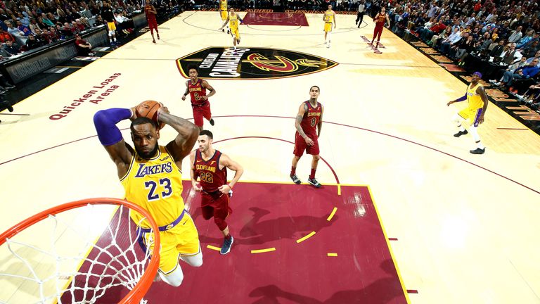 LeBron James throw down a dunk during the Lakers' comeback win over his former team the Cavaliers