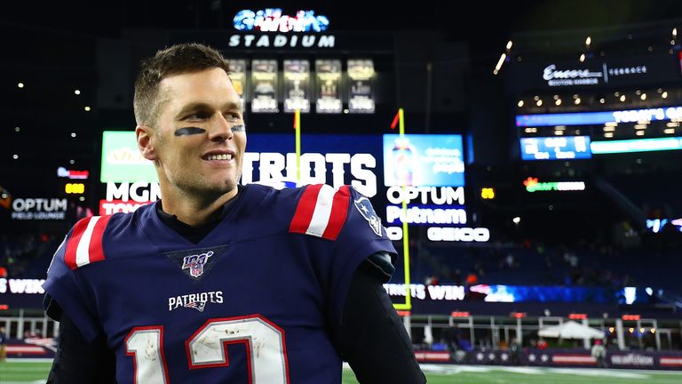 A victorious Tom Brady leaves the field after the Patriots' win over the Giants