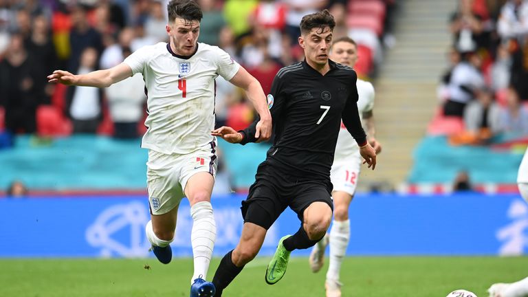 England's Declan Rice, left, and Germany's Kai Havertz vie for the ball during the Euro 2020 soccer championship round of 16 match between England and Germany, at Wembley stadium in London, Tuesday, June 29, 2021. (Andy Rain, Pool via AP)
