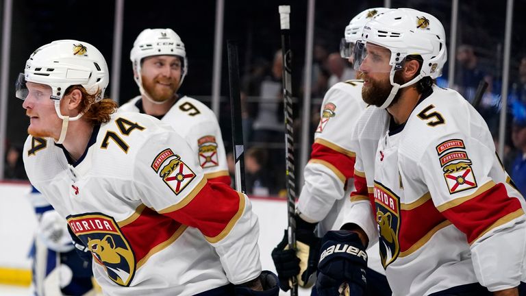Florida Panthers' Owen Tippett (74) celebrates his second goal against the Tampa Bay Lightning with teammates including Aaron Ekblad (5) and Sam Bennett (9) during the third period of an NHL preseason hockey game, Tuesday, Oct. 5, 2021, in Orlando, Fla. (AP Photo/John Raoux)..........