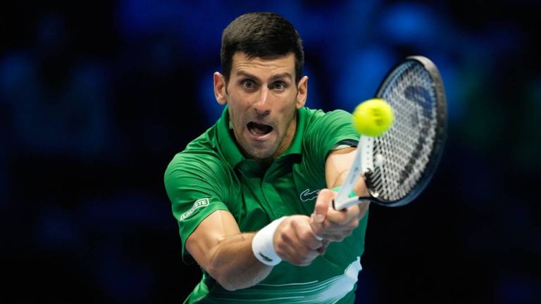Serbia&#39;s Novak Djokovic returns the ball to Russia&#39;s Andrej Rublev during their singles tennis match of the ATP World Tour Finals, at the Pala Alpitour in Turin, Italy, Wednesday, Nov. 16, 2022. (AP Photo/Antonio Calanni)