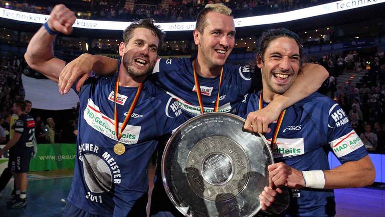 Pascal Hens (center) and brothers Guillaume (left) and Bertrand Gil win the German championship with HSV Hamburg in 2011.