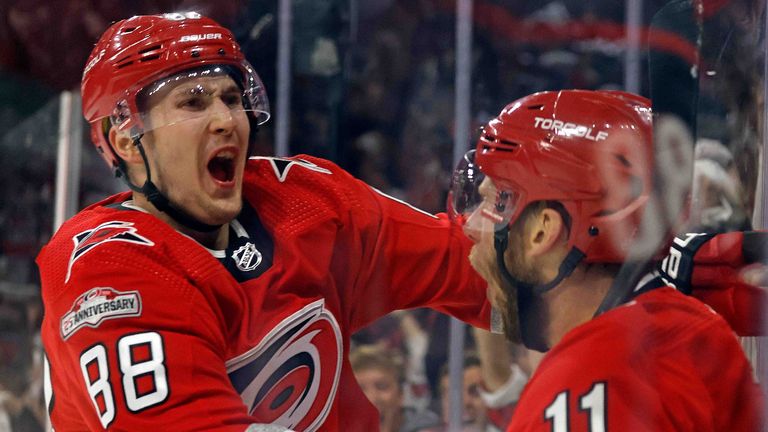 Carolina Hurricanes&#39; Jordan Staal (11) celebrates with teammate Martin Necas (88) after scoring during the second period of Game 2 of an NHL hockey Stanley Cup second-round playoff series against the New Jersey Devils in Raleigh, N.C., Friday, May 5, 2023. (AP Photo/Karl B DeBlaker)