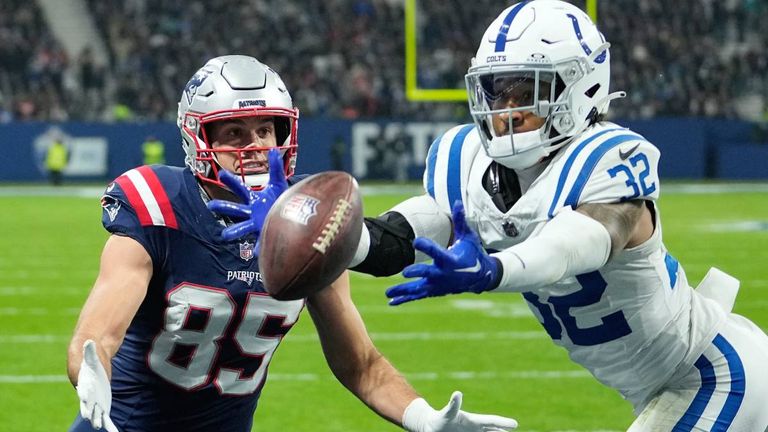 Indianapolis Colts safety Julian Blackmon (32) tries in vain to intercept a pass in the end zone that was intended for New England Patriots tight end Hunter Henry (85) in the second half of an NFL football game in Frankfurt, Germany Sunday, Nov. 12, 2023. (AP Photo/Martin Meissner)