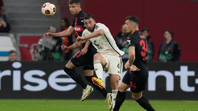 Leverkusen&#39;s Granit Xhaka, right, and Roma&#39;s Bryan Cristante vie for the ball during the Europa League second leg semi-final soccer match between Leverkusen and Roma at the BayArena in Leverkusen, Germany, Thursday, May 9, 2024. (AP Photo/Matthias Schrader)