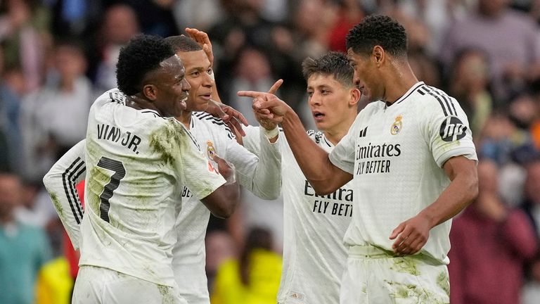 Real Madrid's Kylian Mbappe, second left, celebrates with teammates after scoring his side's second goal during the Spanish La Liga soccer match between Real Madrid and Celta Vigo at the Santiago Bernabeu stadium in Madrid, Spain, Sunday, May 4, 2025. (AP Photo/Jose Breton)