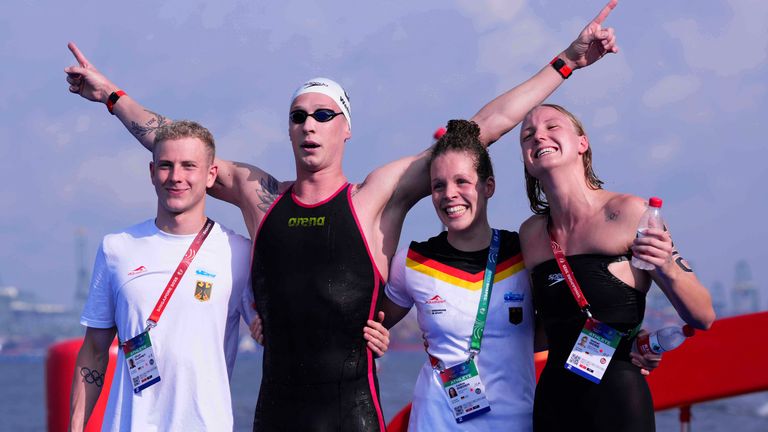 Florian Wellbrock of Germany, second left, celebrates with teammates Oliver Klemet, left, Isabel Gose, right, and Celine Rieder 