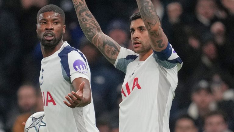 Tottenham's Cristian Romero, right, celebrates after scoring his side's opening goal during the Champions League opening phase soccer match between Tottenham Hotspur and Borussia Dortmund in London, England, Tuesday, Jan. 20, 2026. (AP Photo/Kin Cheung)