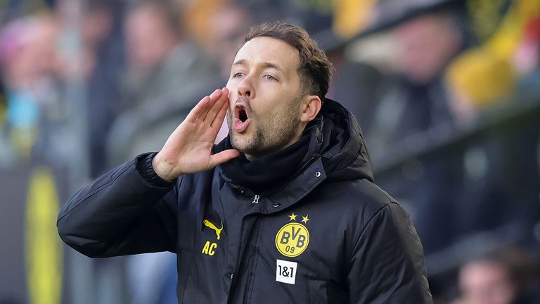 Alex Clapham on the touchline during his time as a coach at Borussia Dortmund