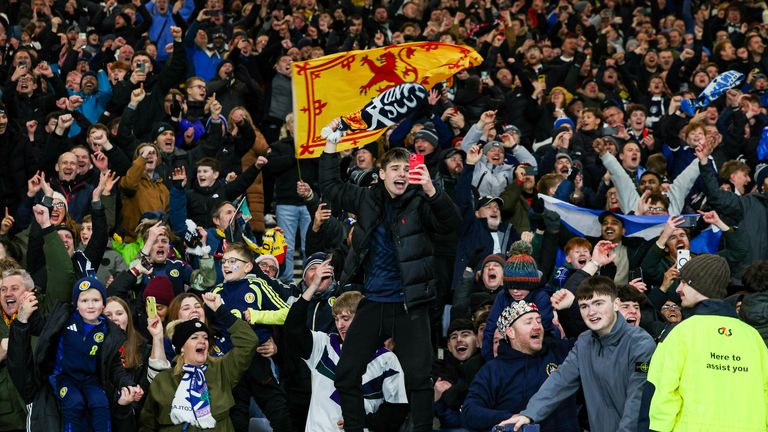 GLASGOW, SCOTLAND - NOVEMBER 18: Scotland fans celebrate at full time during a FIFA World Cup 2026 Qualifier between Scotland and Denmark at Hampden Park, on November 18, 2025, in Glasgow, Scotland. (Photo by Ross Parker / SNS Group)