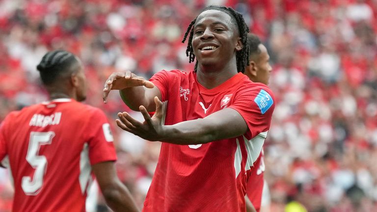 Johan Manzambi celebrates Switzerland's second goal which handed them victory over Canada