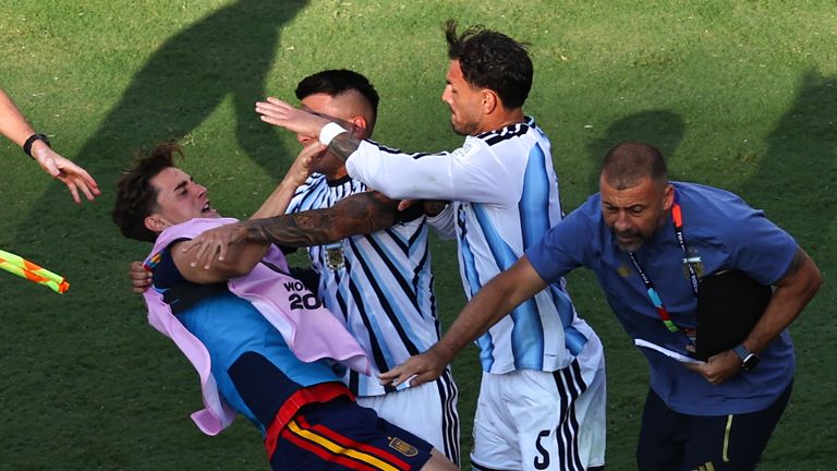 Argentina's Leandro Parades clashes with Spain sub Gavi after the World Cup final