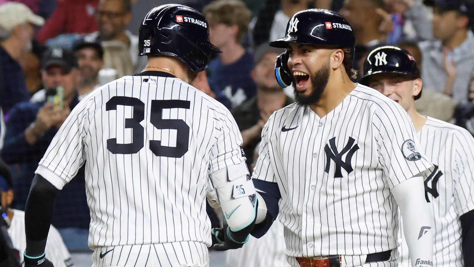 Players celebrating the advancement of the Yankees and White Sox.